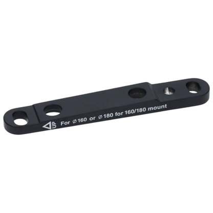 Shimano front flat mount disc brake caliper adapter showing its forged black aluminum body recessed bolt channels and precision threaded mounting interface - Epic Sports Kenya