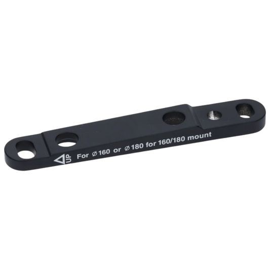Shimano front flat mount disc brake caliper adapter showing its forged black aluminum body recessed bolt channels and precision threaded mounting interface - Epic Sports Kenya
